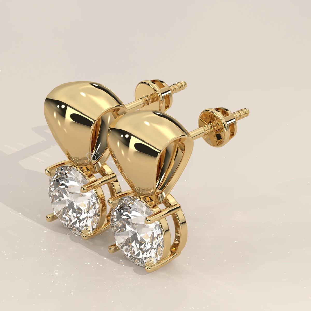 Round Solitaire Lab Grown Diamond Studs Under a Polished Gold Cap in yellow gold, photographed head-on.