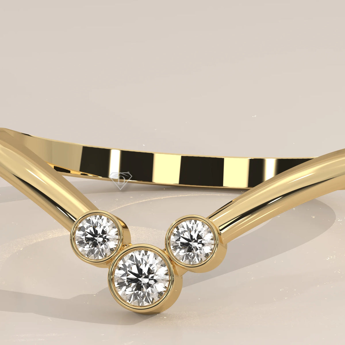 Sharp V Chevron Ring with a Three Diamond Bezel Cluster in yellow gold, photographed at a three-quarter angle.