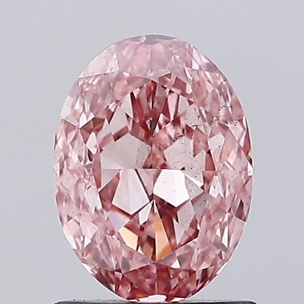 1.23 carat fancy vivid pink oval lab grown diamond SI1 clarity