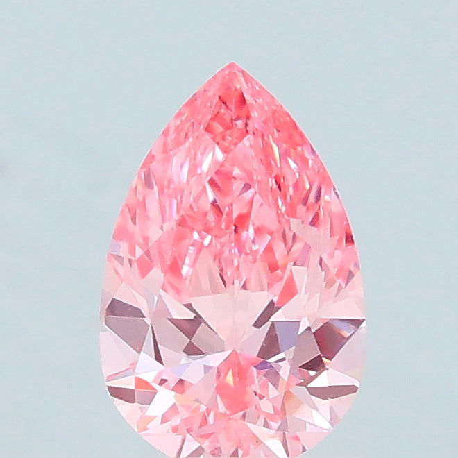 0.63 carat fancy vivid pink pear lab grown diamond VS1 clarity