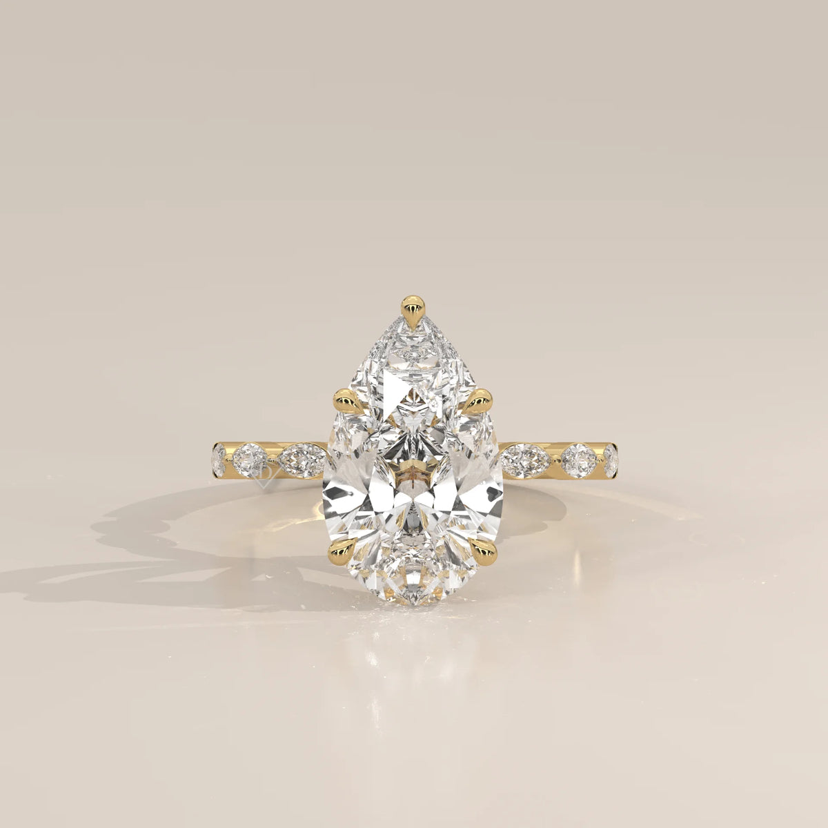 Stlea 5 Carat Pear Lab Grown Diamond Ring, Bezel Marquise Band in yellow gold, photographed head-on.