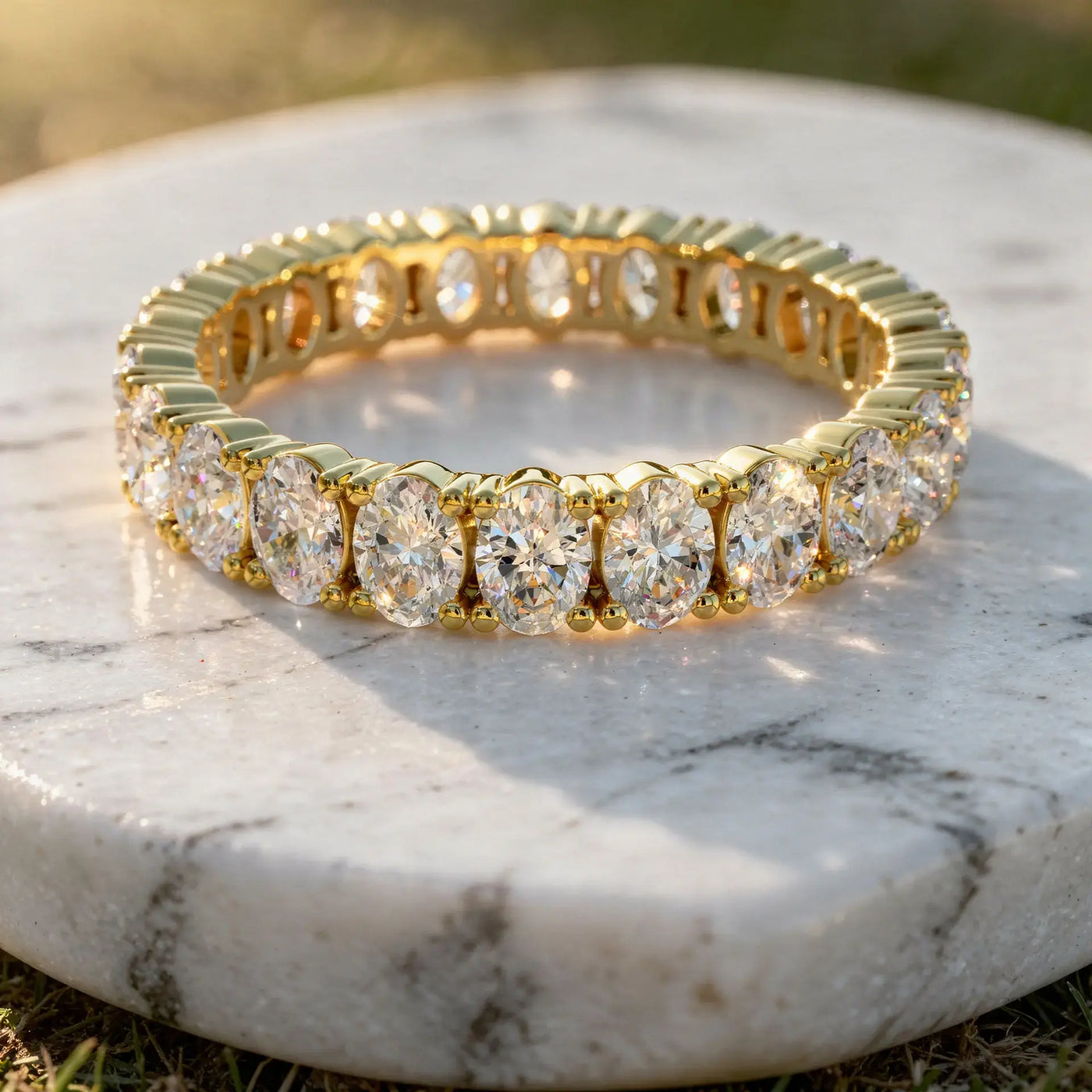 Flat Lay: Oval Diamond Tennis Bracelet with Prong Setting in 14k Yellow Gold - Lab Grown - Driona Jewels