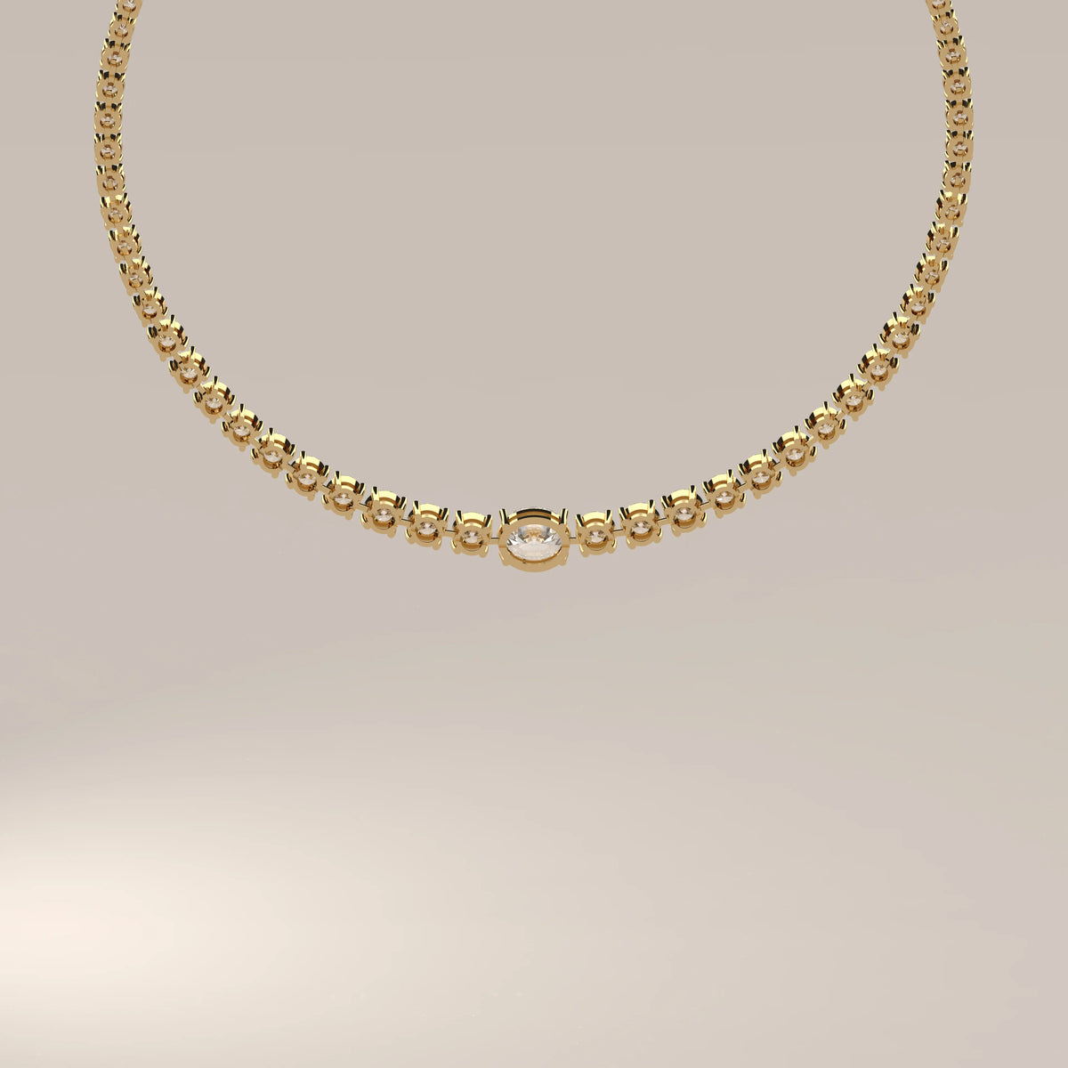 A graduated round lab grown diamond tennis necklace in yellow gold, viewed from overhead.