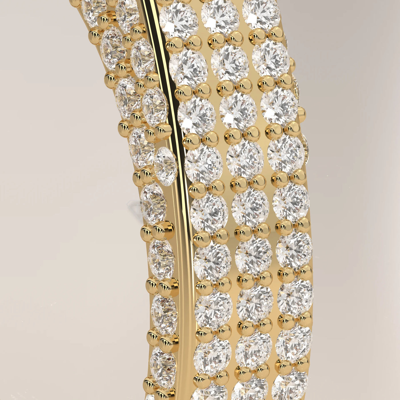 Close-up of a 14k gold ring with three rows of sparkling diamonds.