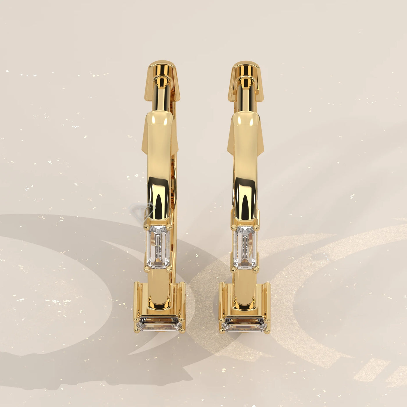 Pair Front View: Emerald Cut Diamond Huggie Hoop Earrings with Three-Stone Setting in Yellow Gold – Lab Grown – Driona Jewels