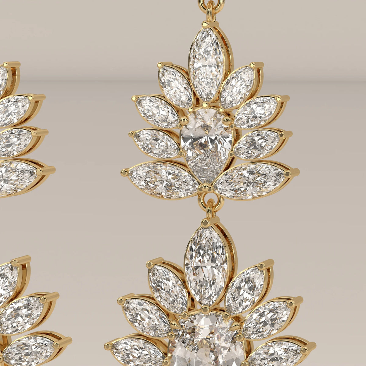 Two Tier Marquise Spray Lab Grown Diamond Chandelier Earrings in yellow gold, studio photograph on a plain background.