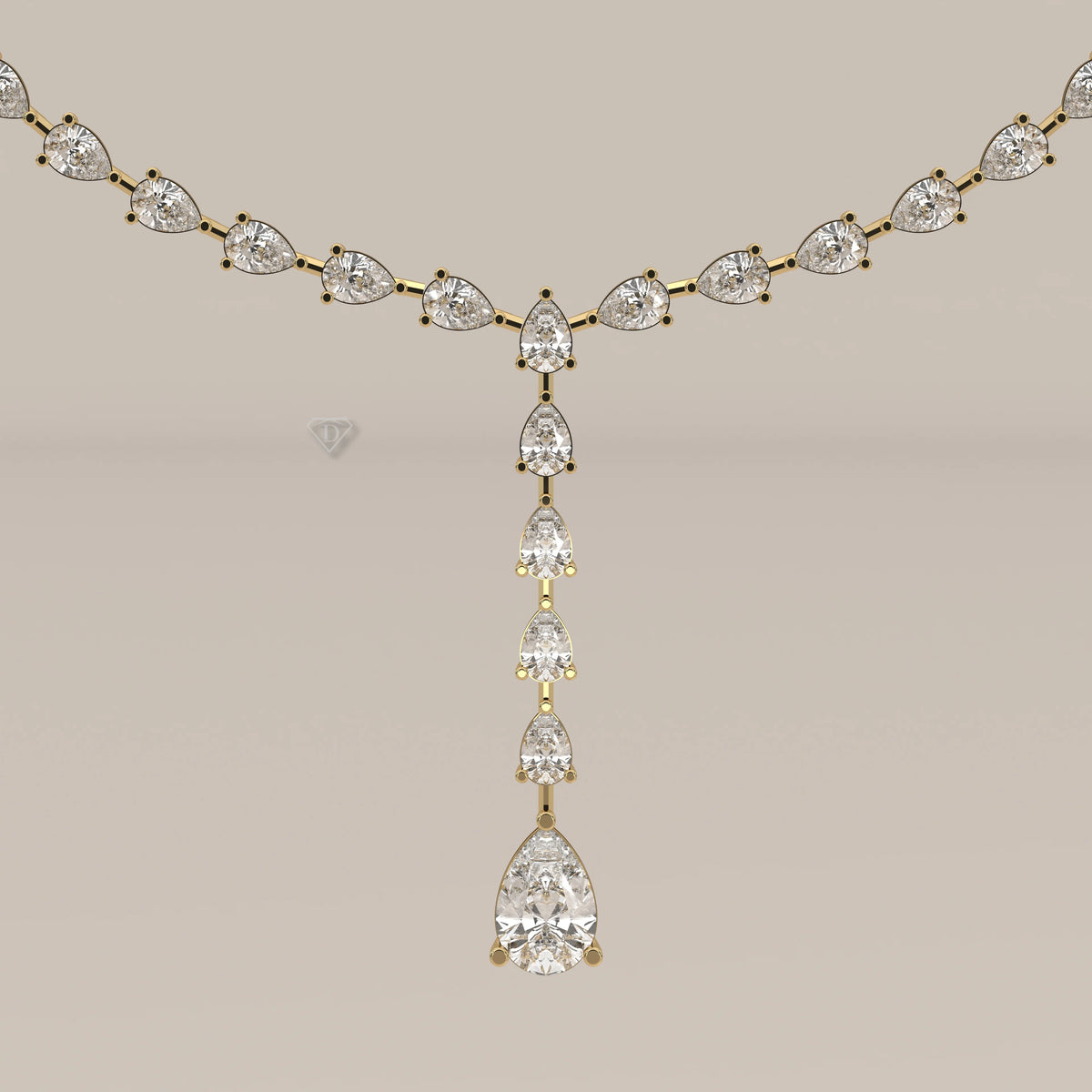 A pear shape lab grown diamond drop necklace in yellow gold, shown on a plain background.