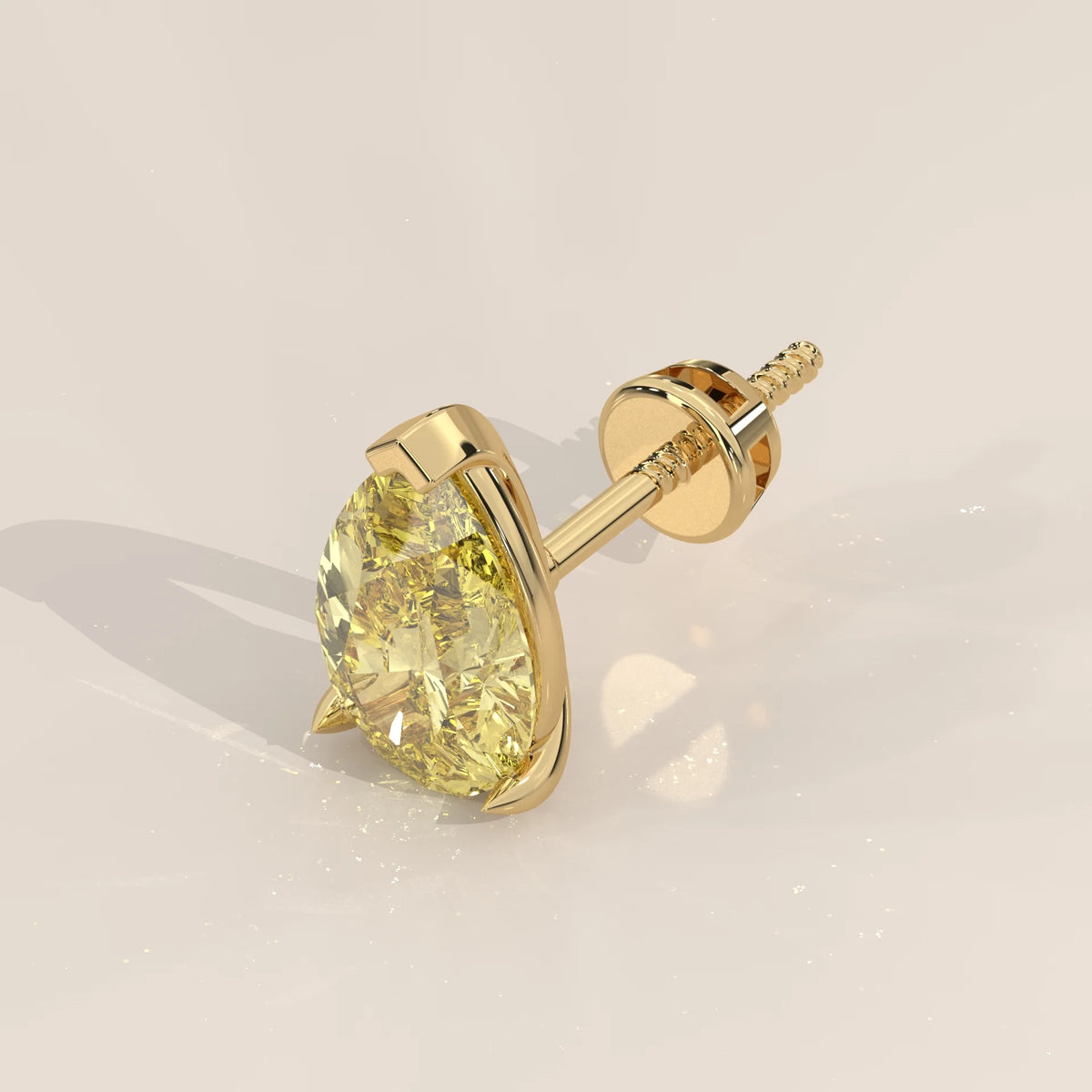 Angled View: Pear Yellow Diamond Single Stud Earring with 3-Prong Setting in 14K Yellow Gold – Lab Grown – Driona Jewels