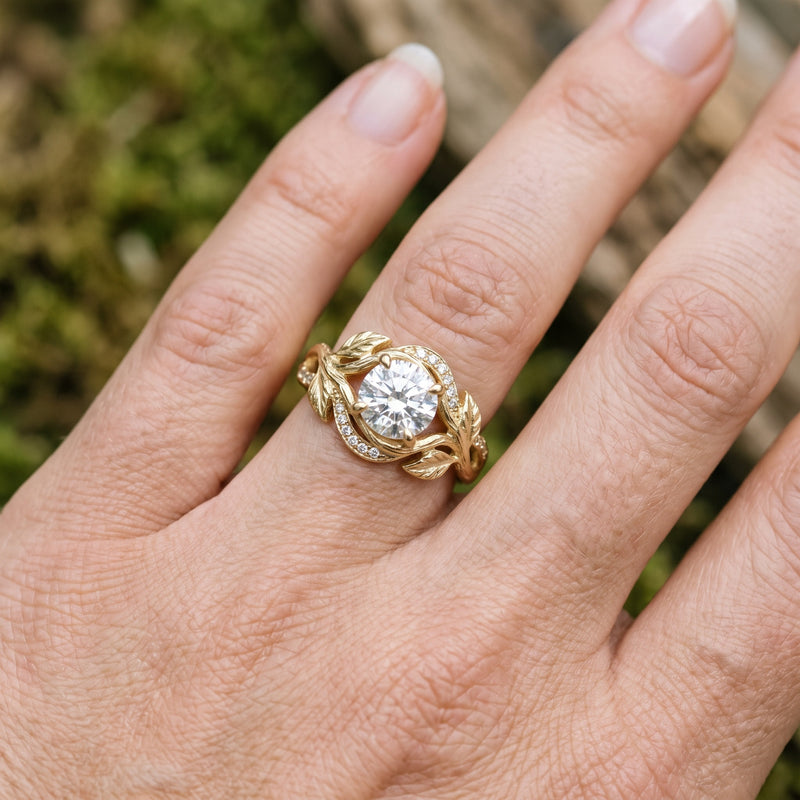 Nature inspired diamond ring with sculpted gold leaf and vine detailing