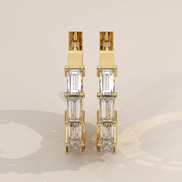 Pair Front View: Baguette Diamond Huggie Hoop Earrings with Prong Setting in Yellow Gold – Lab Grown – Driona Jewels