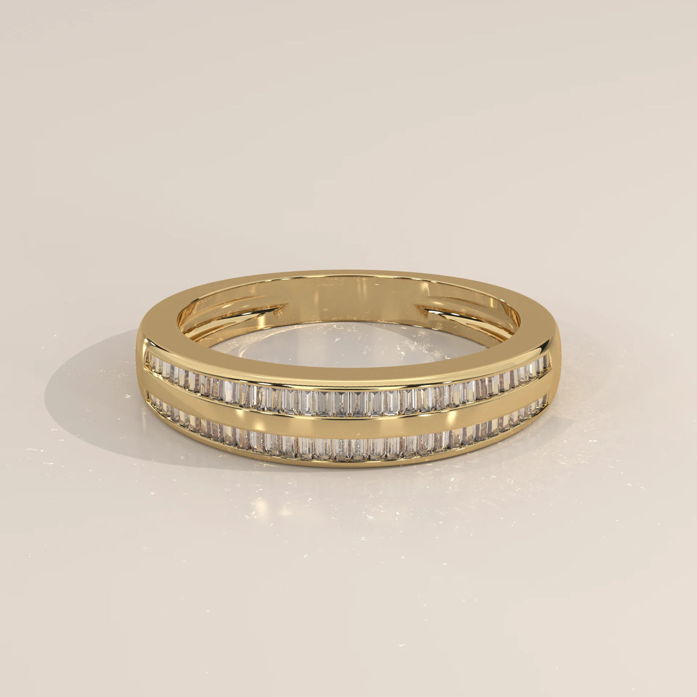 A yellow gold band ring with two rows of baguette-cut diamonds.