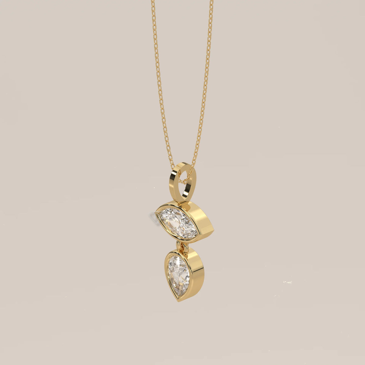 Bezel Marquise and Pear Lab Grown Diamond Articulated Drop Pendant in yellow gold, shown on a plain background.