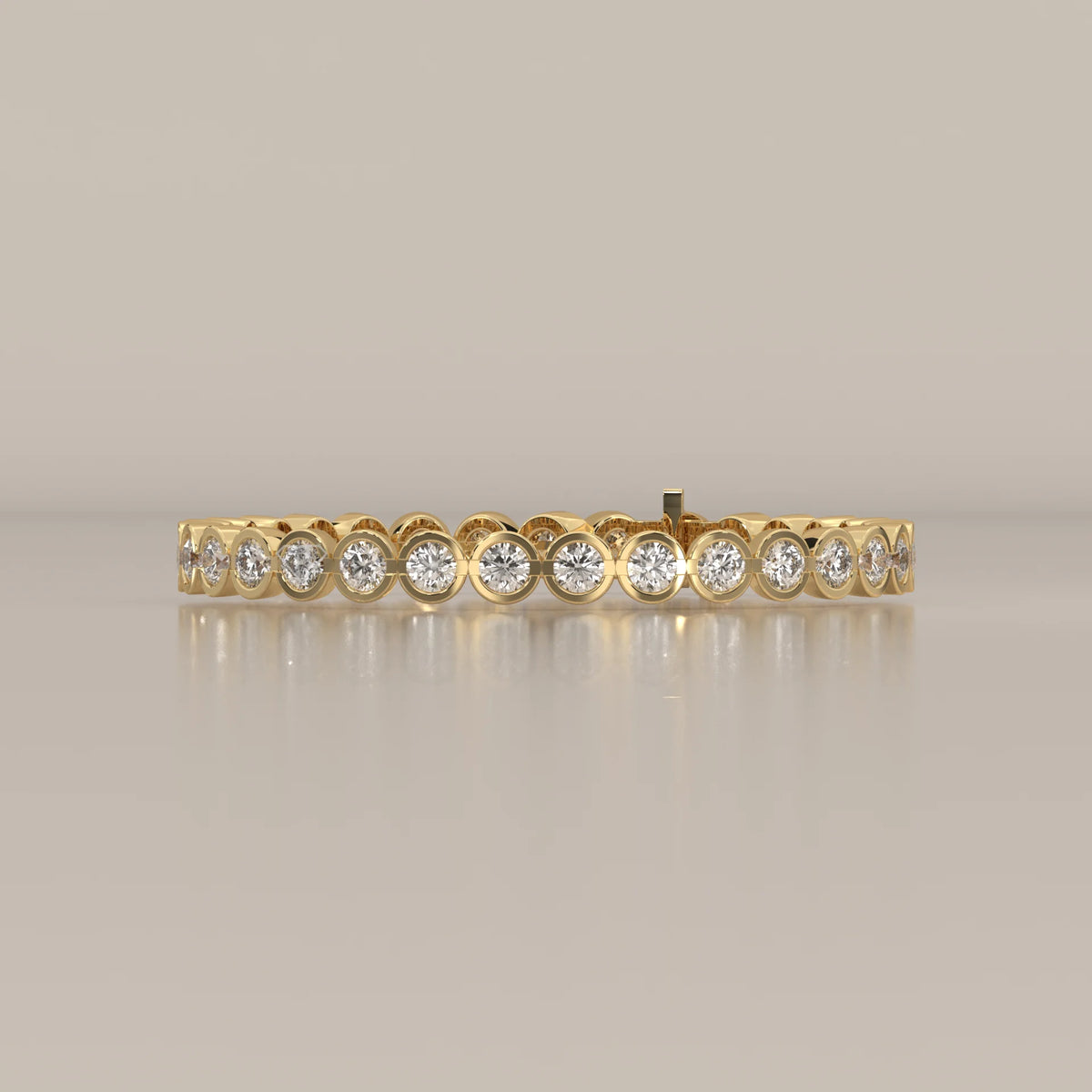 A delicate gold bracelet with bezel-set diamonds.