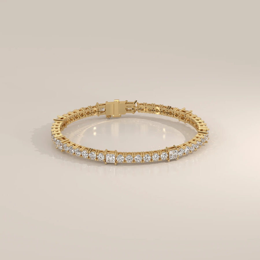 A delicate 14k gold bracelet with numerous square-cut diamonds.