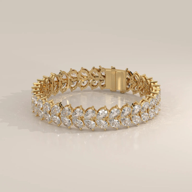 Elegant yellow gold bracelet featuring two rows of marquise-cut diamonds.