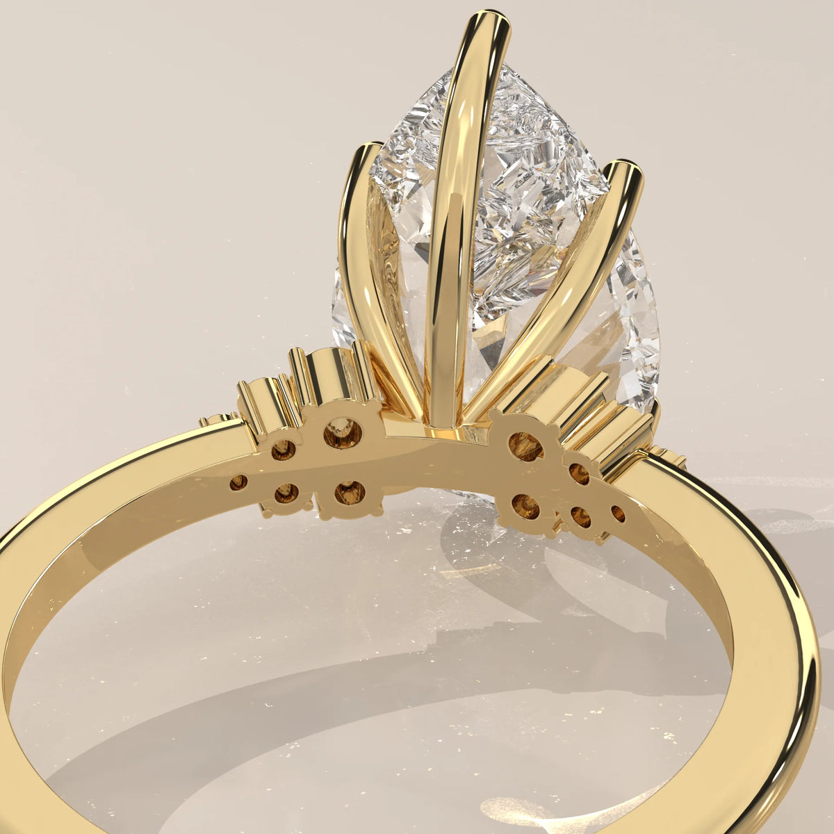 Bronze 5 Carat Pear Lab Grown Diamond Ring, Cluster Shoulders in yellow gold, product photograph on a plain background.