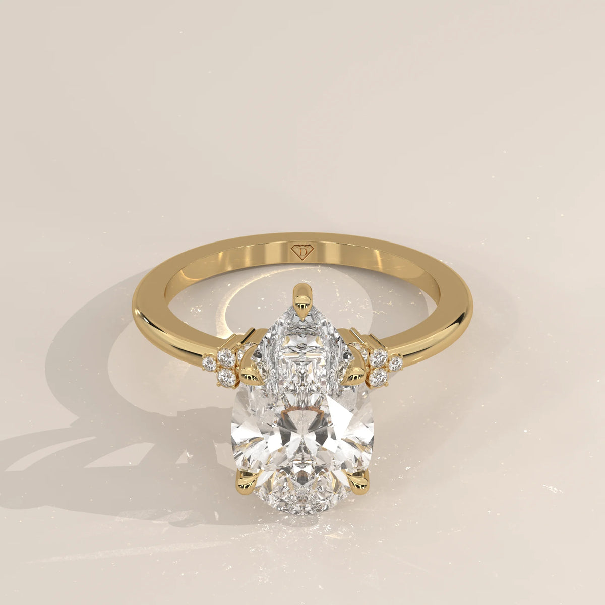 Bronze 5 Carat Pear Lab Grown Diamond Ring, Cluster Shoulders in yellow gold, shown from the front.