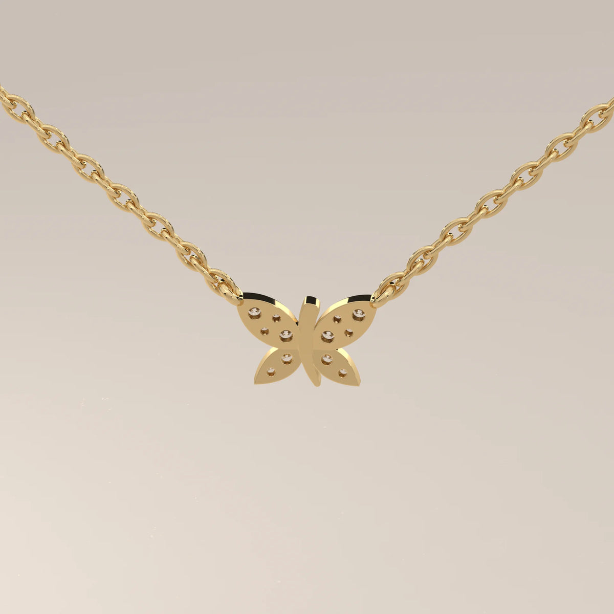 Delicate gold necklace with a butterfly pendant adorned with small stones.