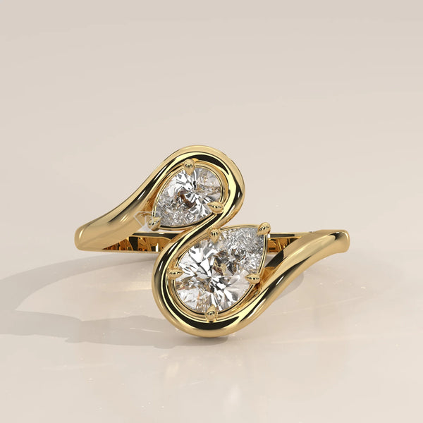 Yellow gold bypass ring with two pear-cut diamonds