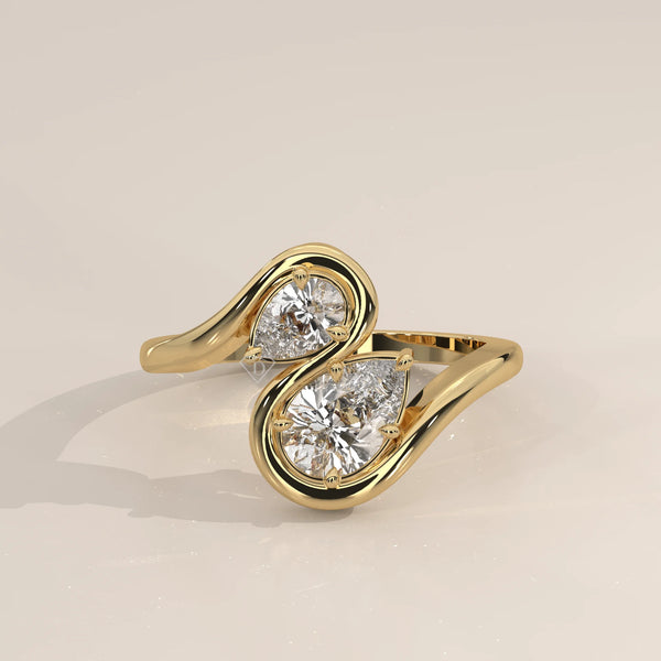 Two Pear Lab Grown Diamond Toi et Moi Ring with S Shaped Outline in yellow gold, photographed head-on.