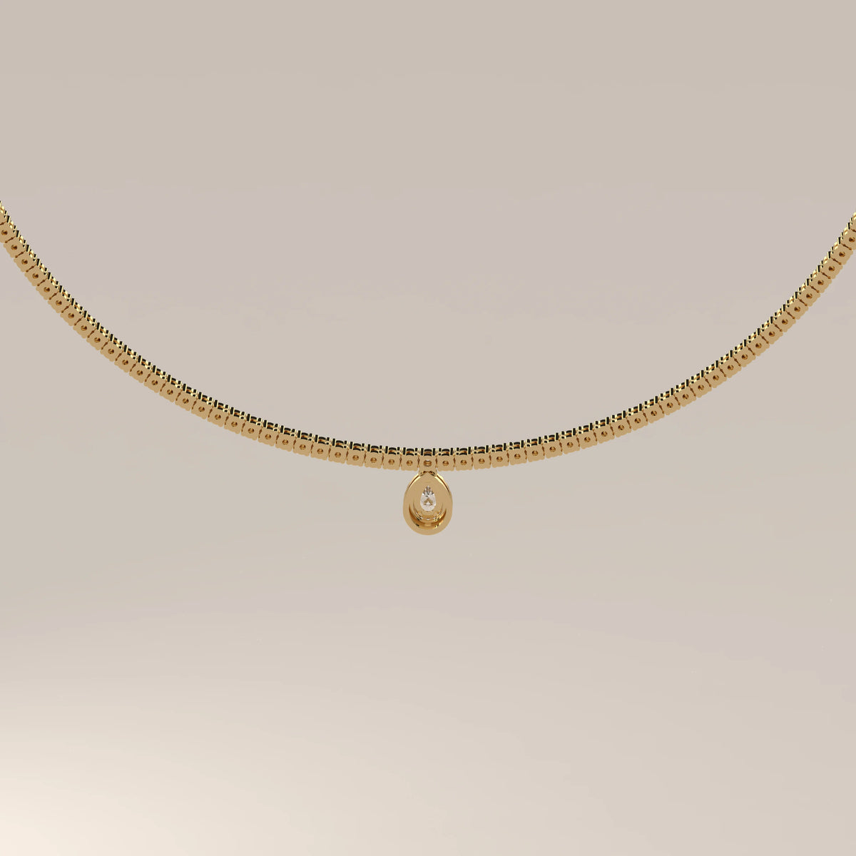 A pear halo lab grown diamond teardrop tennis necklace in yellow gold, photographed head-on.