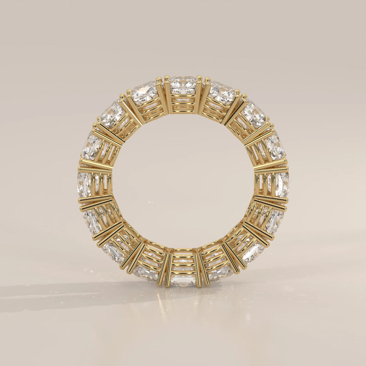 Chunky Cushion Square Diamond Eternity Ring with Bold Claws in yellow gold, front view on a plain background.