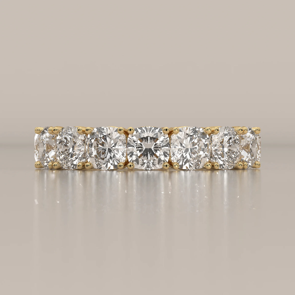 Chunky Cushion Square Diamond Eternity Ring with Bold Claws in yellow gold, shown from the front.