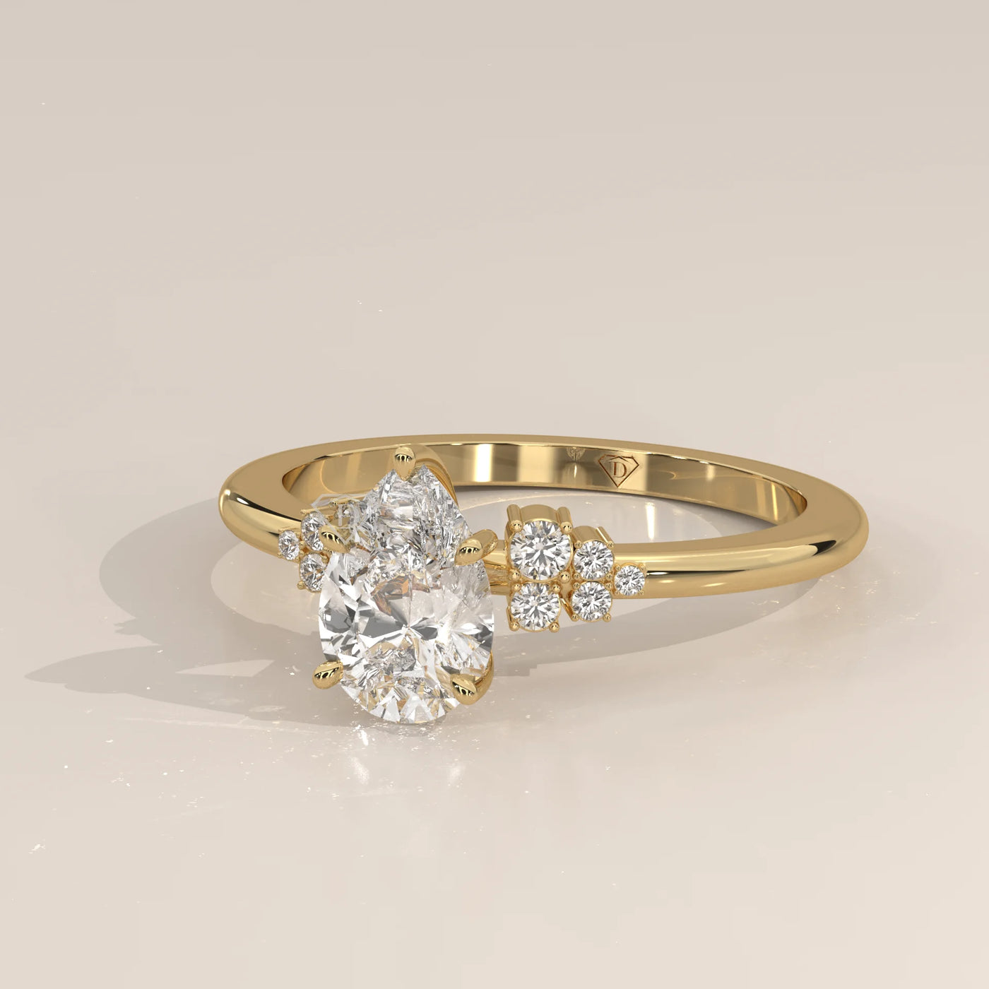 A yellow gold ring with an oval diamond and smaller accent diamonds.