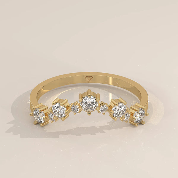 Yellow gold contour band with seven graduated round lab grown diamonds claw set in an arc, shown from the front.
