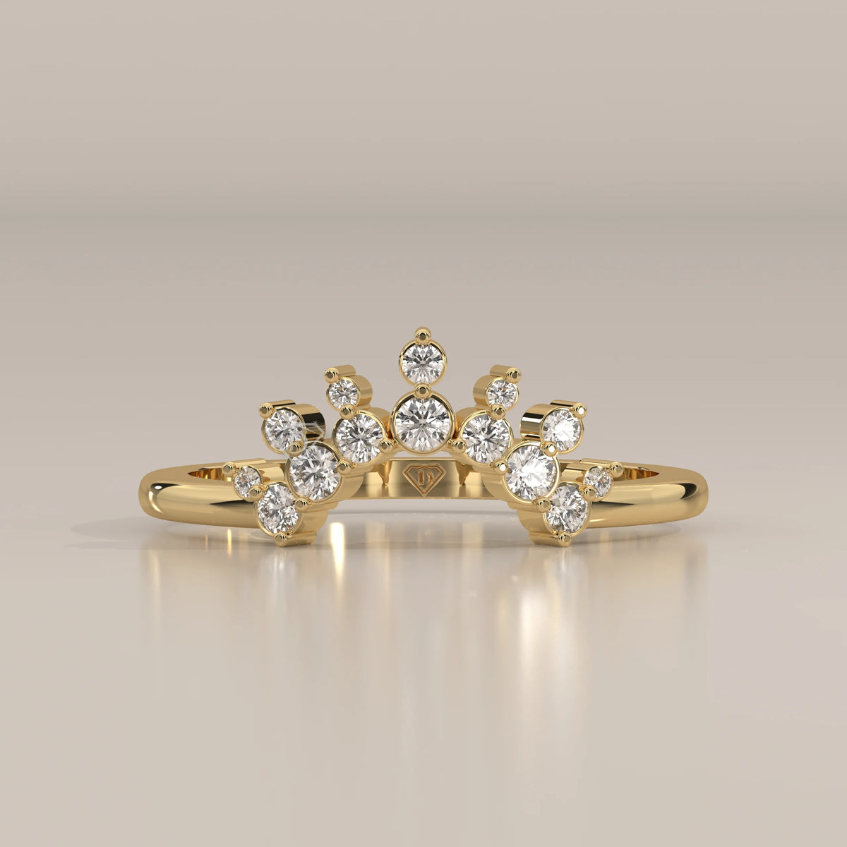 Yellow gold curved band with clustered peaks of round lab grown diamonds around a raised middle stone, front view on a plain background.