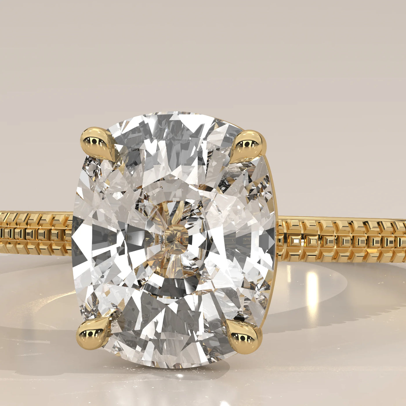 A 14k yellow gold ring with a large cushion-cut diamond.