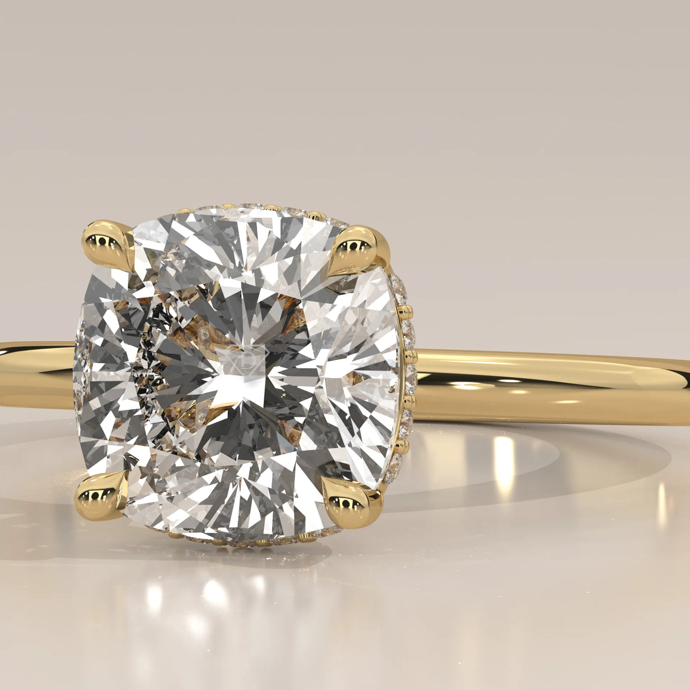 Yellow gold engagement ring with a large cushion-cut diamond.