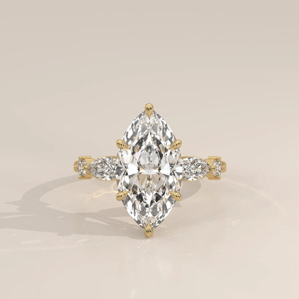 Daiva 5 Carat Marquise Lab Grown Diamond Ring, East West Accents in yellow gold, photographed head-on.