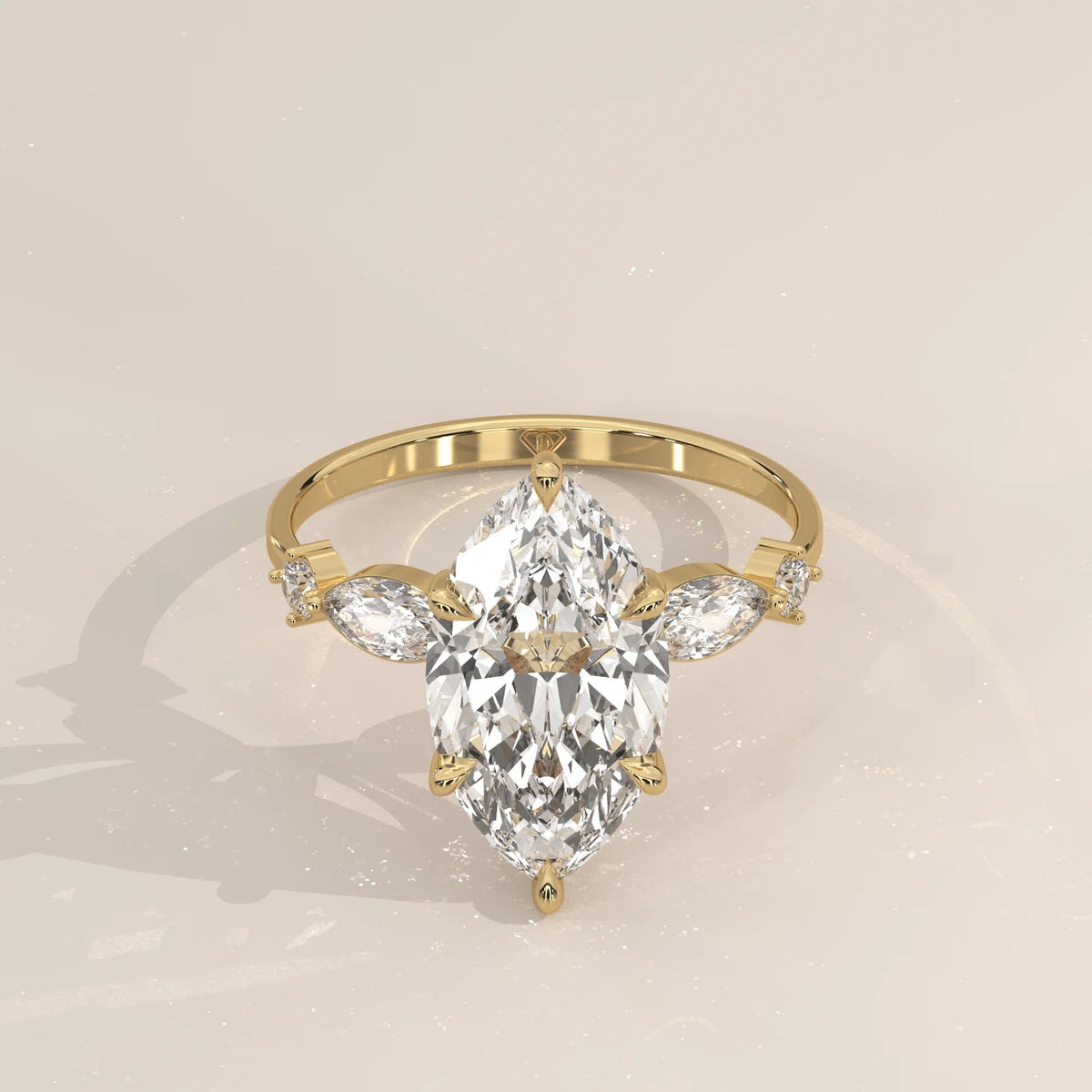 Daiva 5 Carat Marquise Lab Grown Diamond Ring, East West Accents in yellow gold, shown from the front.