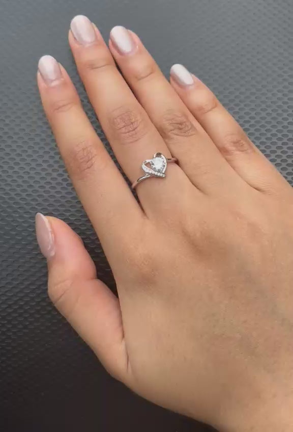 Heart halo solitaire ring