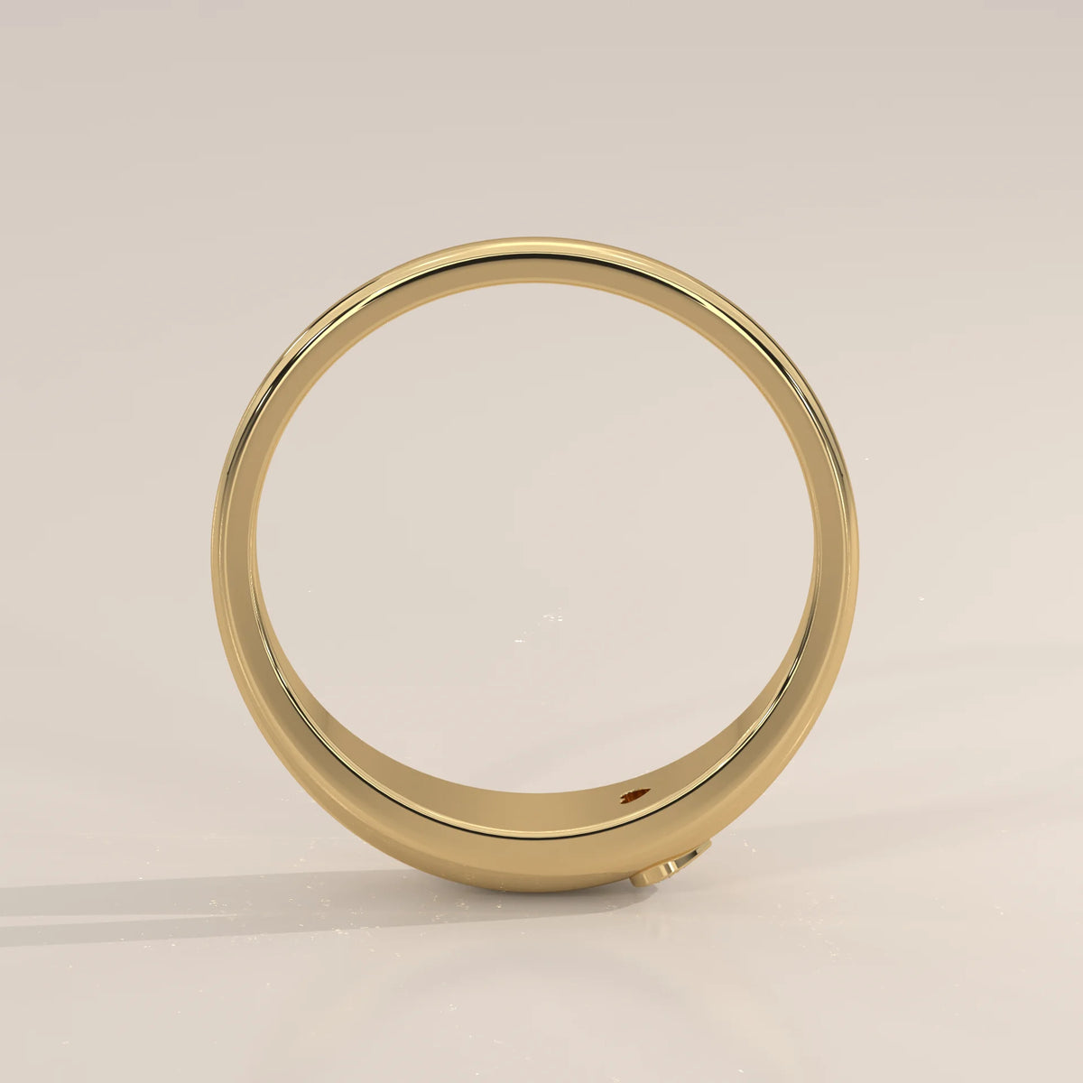 Domed Gold Band with a Small Flush Set Heart Diamond in yellow gold, shown from the side.