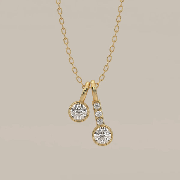 Double Drop Bezel Round Lab Grown Diamond Pendant with Pave Stem in yellow gold, shown from the front.