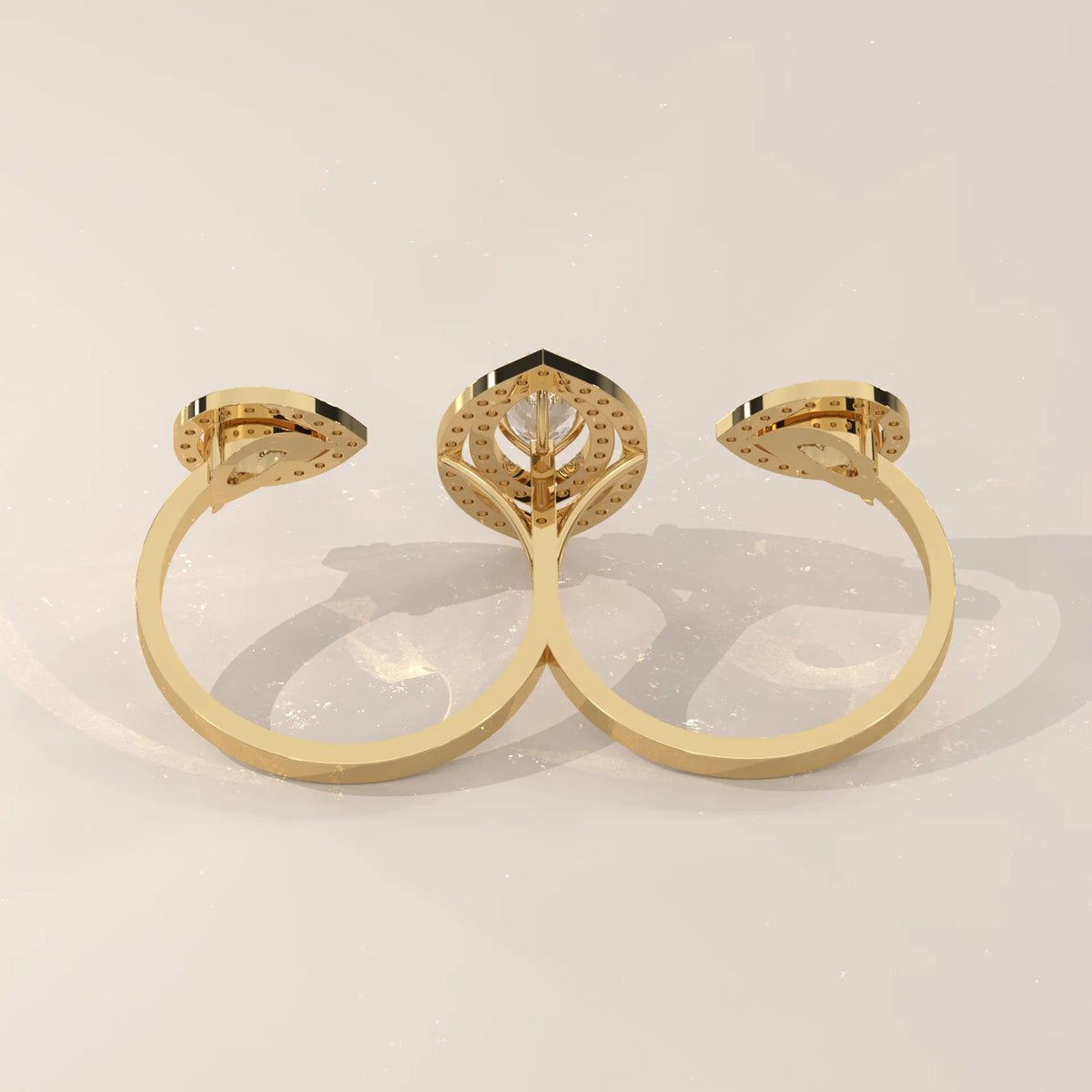 Marquise Lab Grown Diamond Double Halo Two Finger Ring with Pear Ends in yellow gold, front view on a plain background.