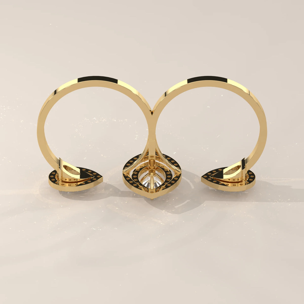 Marquise Lab Grown Diamond Double Halo Two Finger Ring with Pear Ends in yellow gold, product photograph on a plain background.