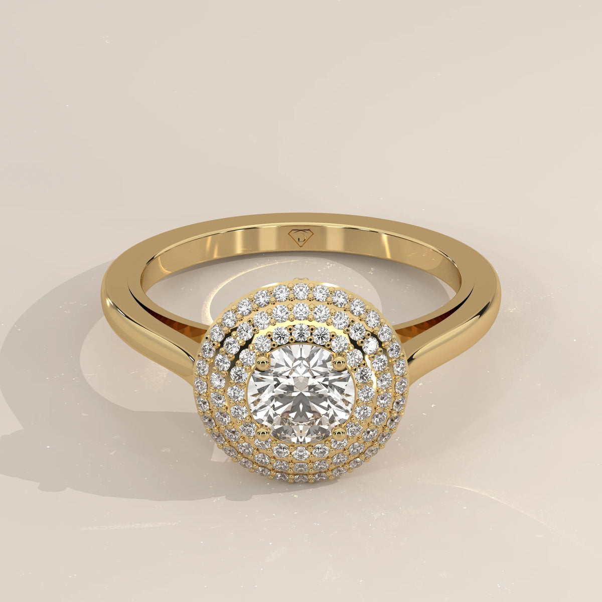 Round Lab Grown Diamond Domed Triple Halo Pave Ring in yellow gold, shown from the front.