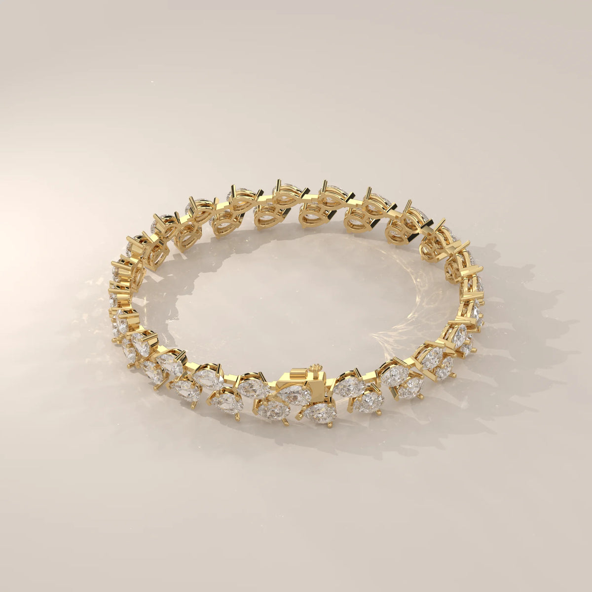 Double Row Tilted Pear Lab Grown Diamond Tennis Bracelet in yellow gold, photographed at a three-quarter angle.