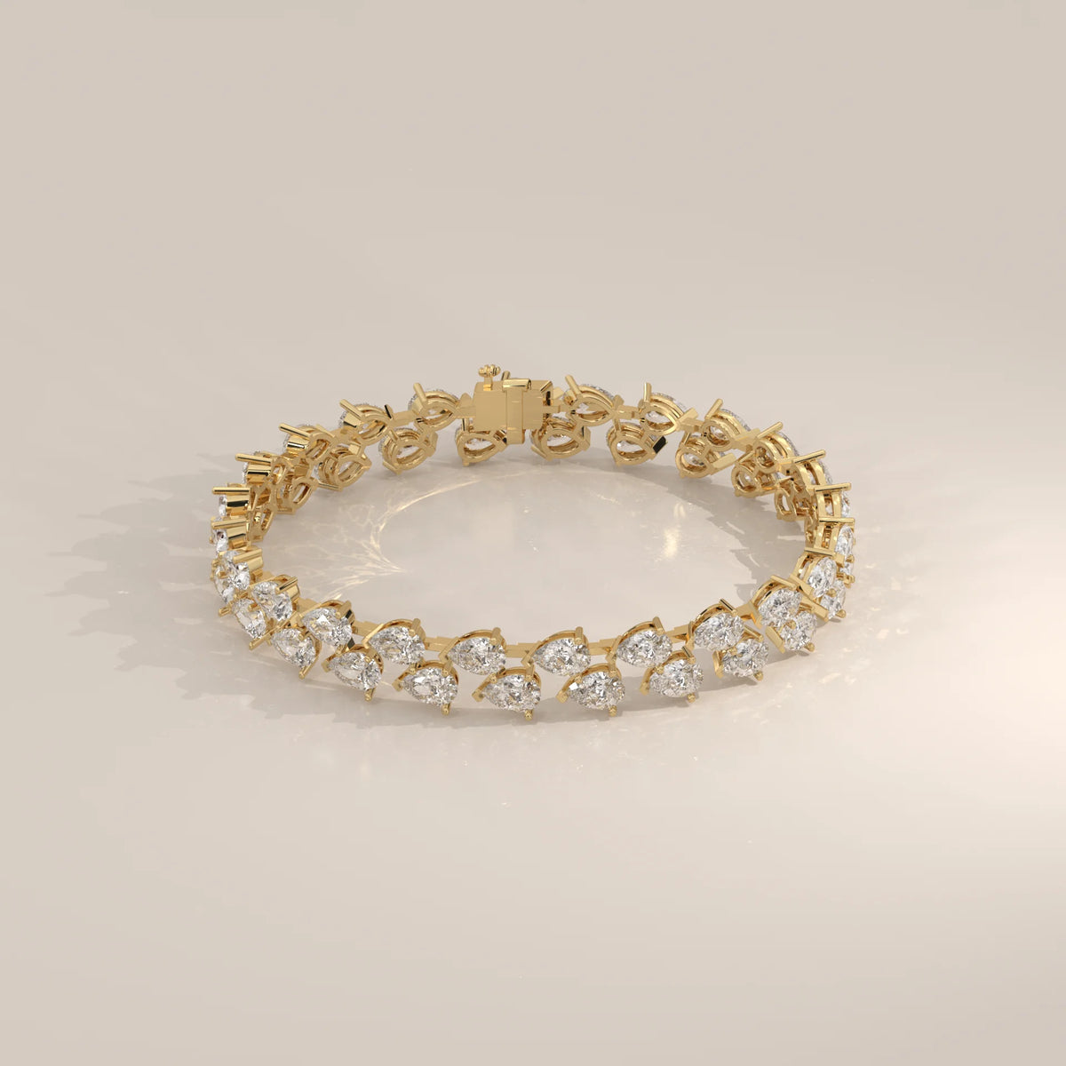 Double Row Tilted Pear Lab Grown Diamond Tennis Bracelet in yellow gold, shown at an angle.