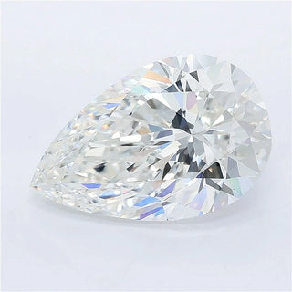 A brilliant pear cut lab grown diamond with multi-colored light reflections on a white background.