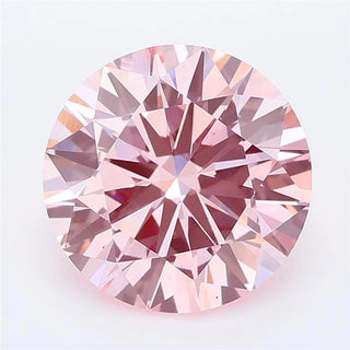Round cut intense pink lab grown diamond with brilliant facet patterns on a white background.