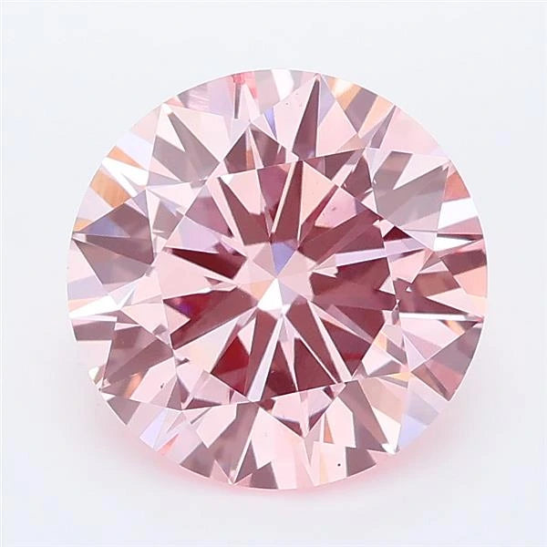 Round cut intense pink lab grown diamond with brilliant facet patterns on a white background.