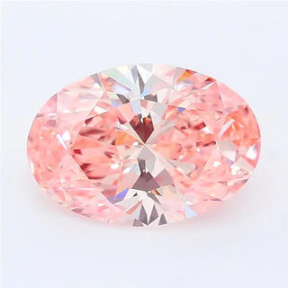 Oval cut intense pink lab grown diamond with brilliant faceting on a white background.