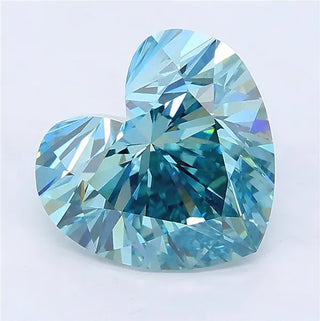 Heart-cut vivid green-blue lab-grown diamond with brilliant facets on a white background.