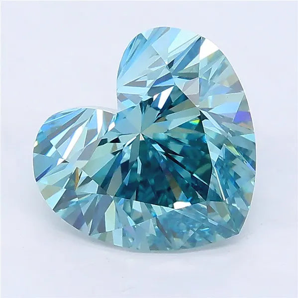 Heart-cut vivid green-blue lab-grown diamond with brilliant facets on a white background.