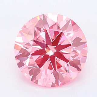 Round cut vivid pink lab grown diamond with a brilliant facet pattern and IGI certification.