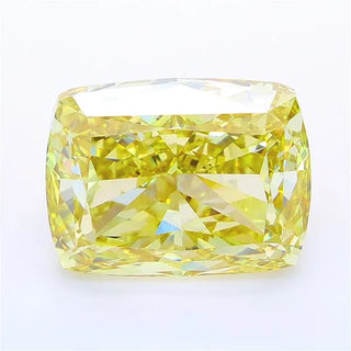 Cushion cut intense yellow lab grown diamond with brilliant facets on a white background.